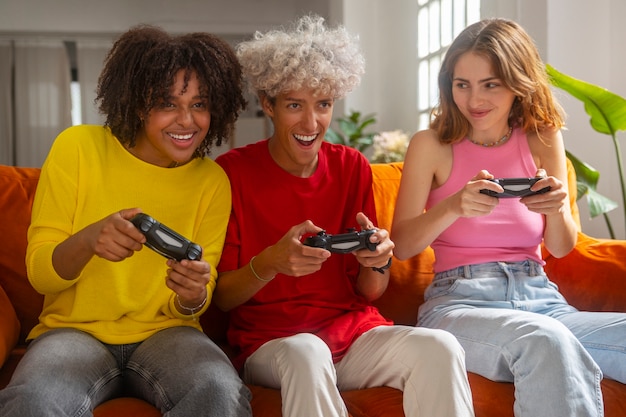 A group of friends laughing and playing on a retro Nintendo 64 console in a cozy living room setting. The lighting is warm and inviting, and the friends are visibly enjoying the shared experience of playing a classic video game.