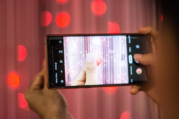 Close-up shot of a smartphone screen displaying a typical 'Invisible Challenge' video on TikTok, with comments and likes visible.