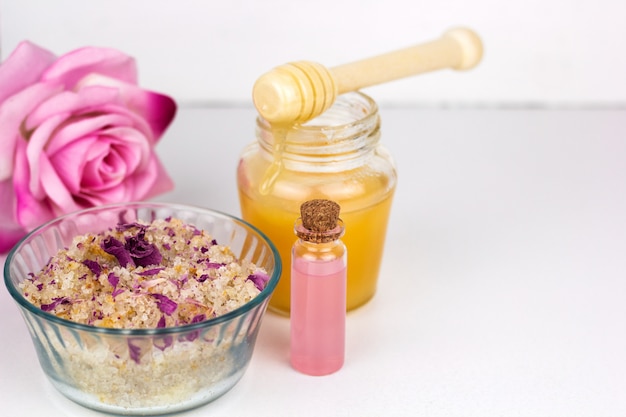 A well-lit photo showcasing a variety of safe DIY skincare ingredients: raw honey in a jar, colloidal oatmeal in a bowl, aloe vera leaf with extracted gel, and ripe avocado halves. The ingredients are arranged neatly on a clean surface.