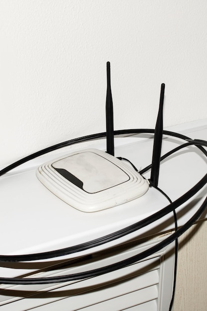 A side-by-side comparison of a cable modem and a 5G home internet receiver, visually highlighting the difference in hardware and connection type. The image should show the back panels with the various ports and connections.