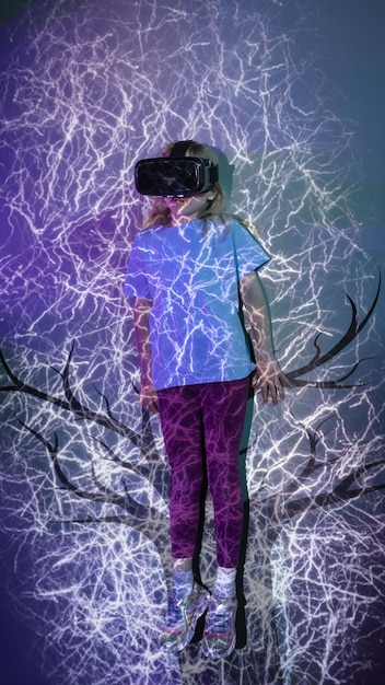 A close-up shot of a person wearing a VR headset, fully immersed in a virtual environment. The background shows a stylized representation of social media icons and data streams.