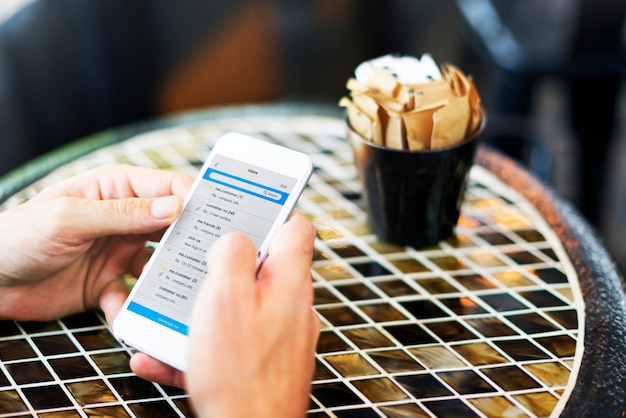 A close-up of a smartphone screen displaying a rebate submission form with fields for receipt upload, product review, and social media share options.