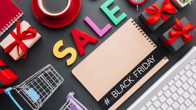 A cluttered desk with shopping bags, receipts, and a calculator, symbolizing the potential for impulse buying and financial disorganization during Black Friday sales.
