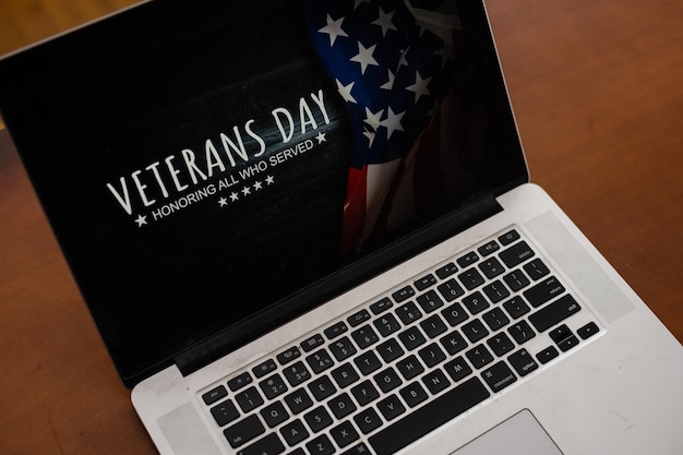 A laptop screen displaying a website that lists various military discounts and offers. Veteran-friendly logos of different companies are visible, making the focus on a centralized resource for discounts.