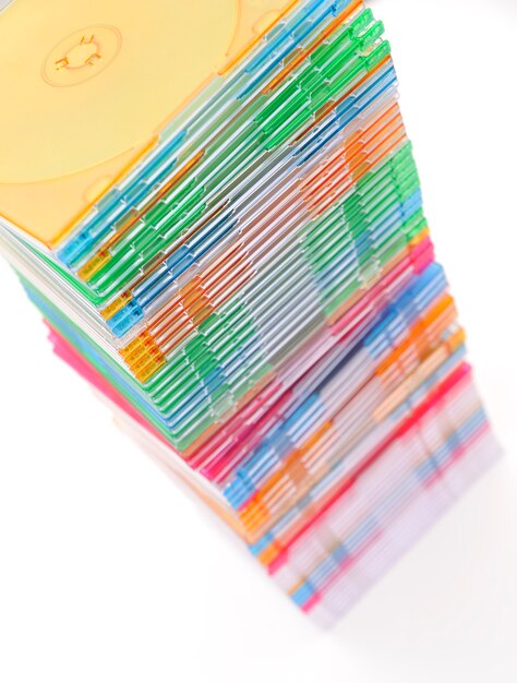 A split image showing a disorganized mess of coupons on one side and a neatly organized coupon binder on the other side.
