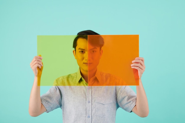 A split screen showing two contrasting scenarios: On one side, a person smiling and holding up a phone showing likes/comments on a food challenge video; on the other side, the same person looking anxious and clutching their stomach in a hospital waiting room.