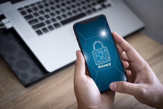 A person receiving a phishing email on their phone, with a fake logo and urgent tone. The background shows a secure lock icon, representing the need for security awareness.