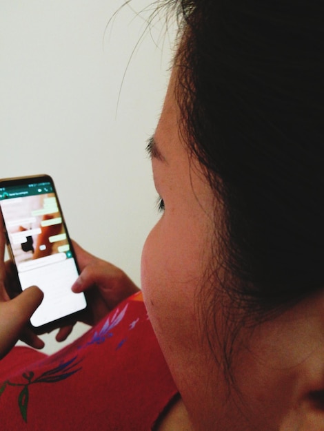 A split-screen image: one side showing a person scrolling through a deal-focused Instagram account on their phone, and the other side displaying a Facebook group dedicated to sharing Amazon coupon codes.